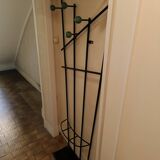 Wall-mounted metal coat rack
