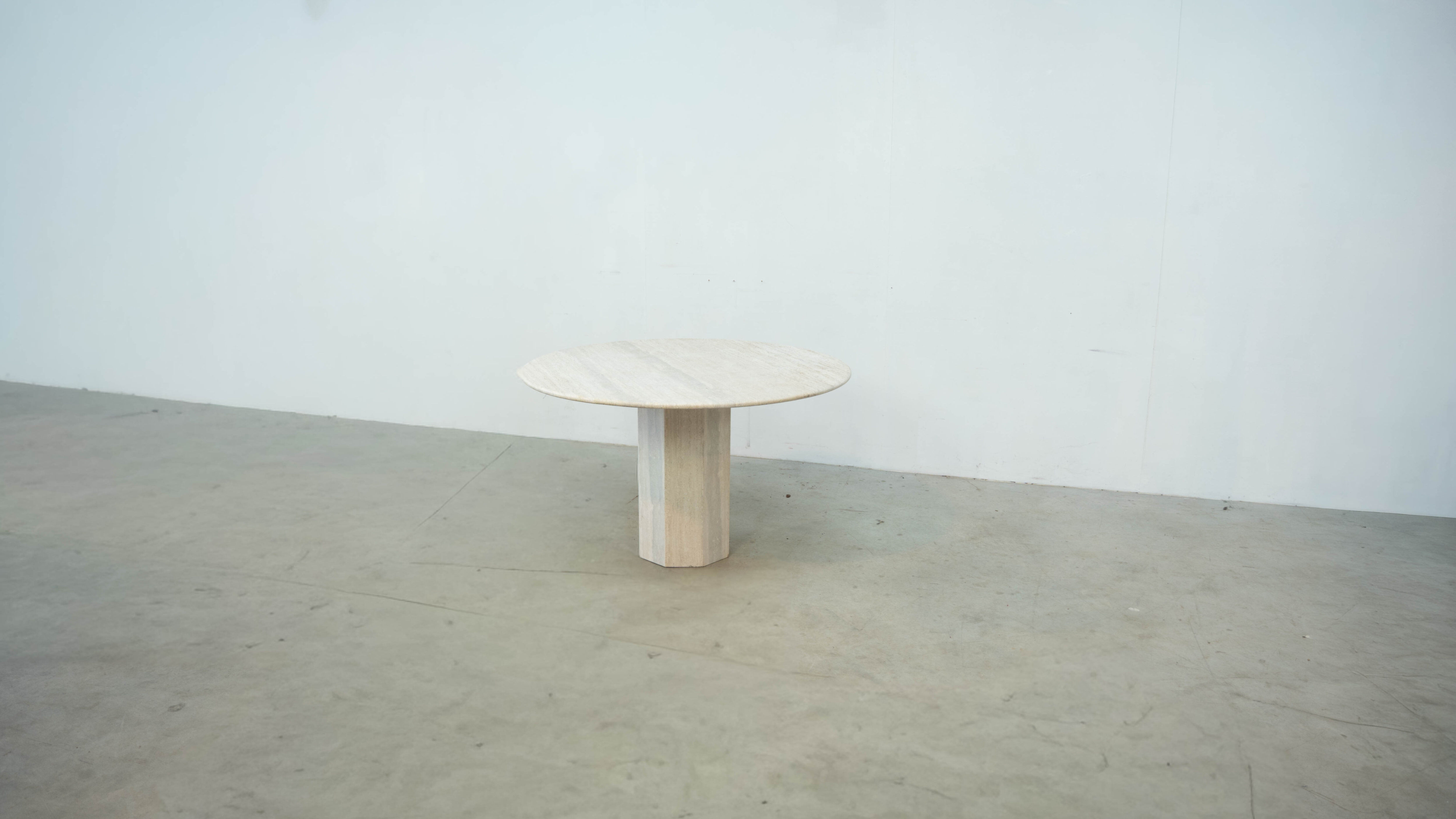 Round Belgian travertine dining table