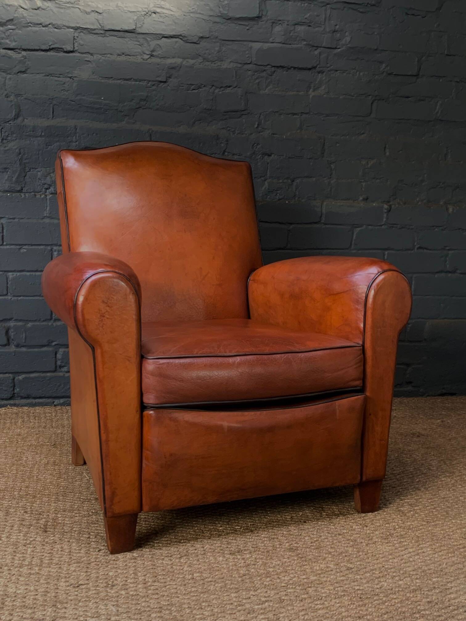 French leather club chair, chapeau de gendarme model circa 1930's in caramel