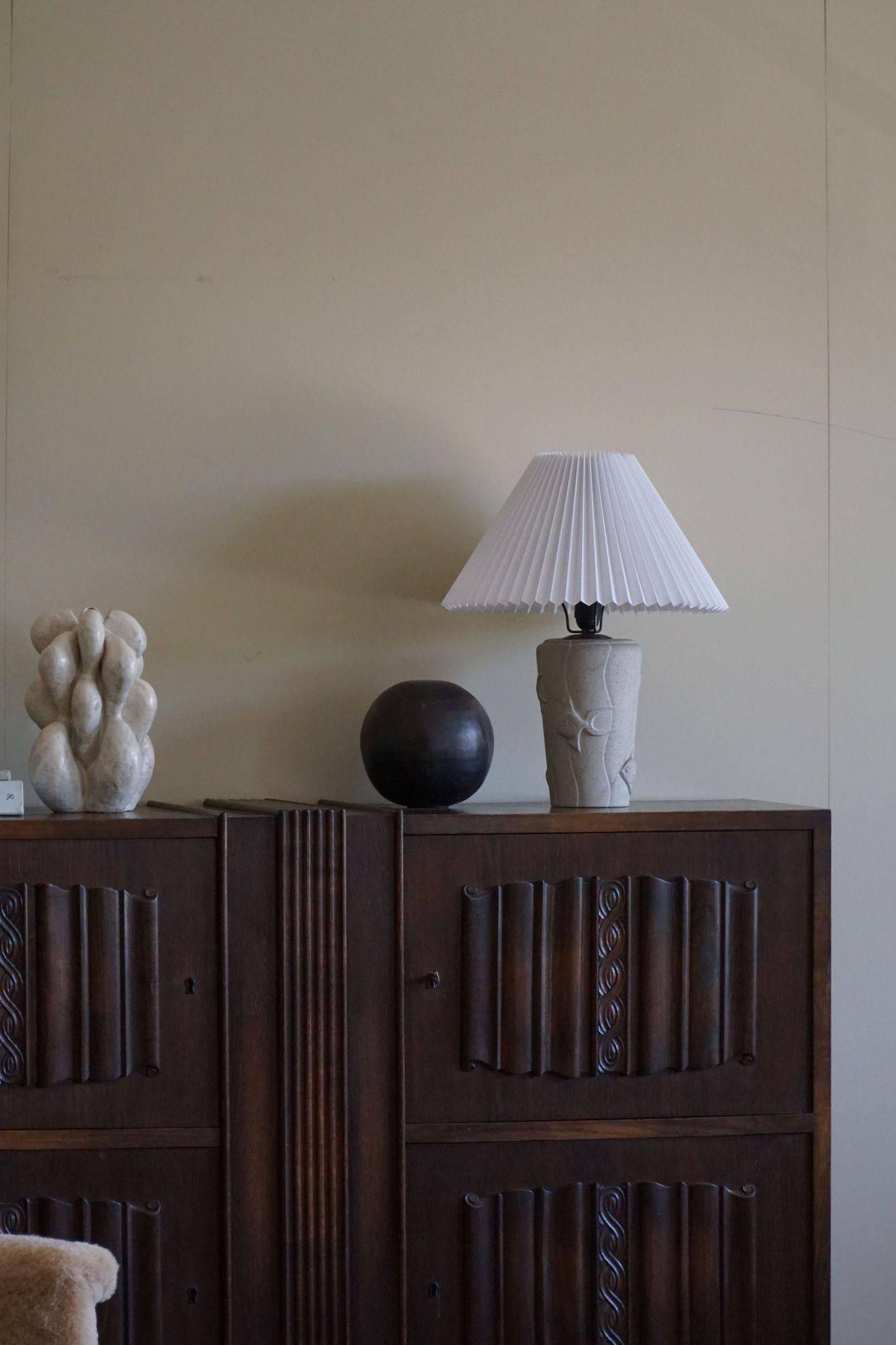 Modern vintage French table lamp, made of stone with fish patterns, 1970s.