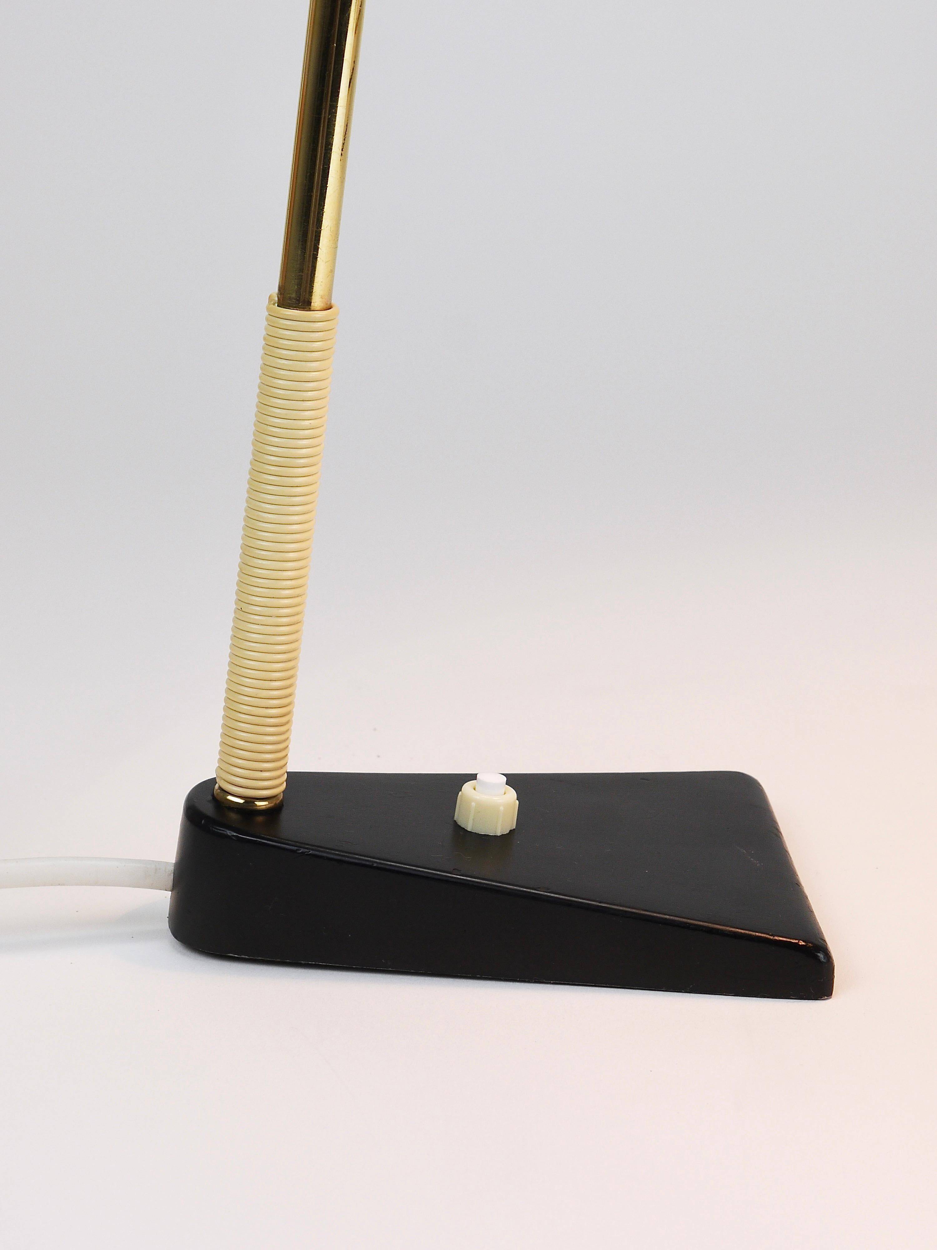 Yellow desk, table or accent lamp by J.T. Kalmar, brass and iron, Vienna, Austria, 1950s.