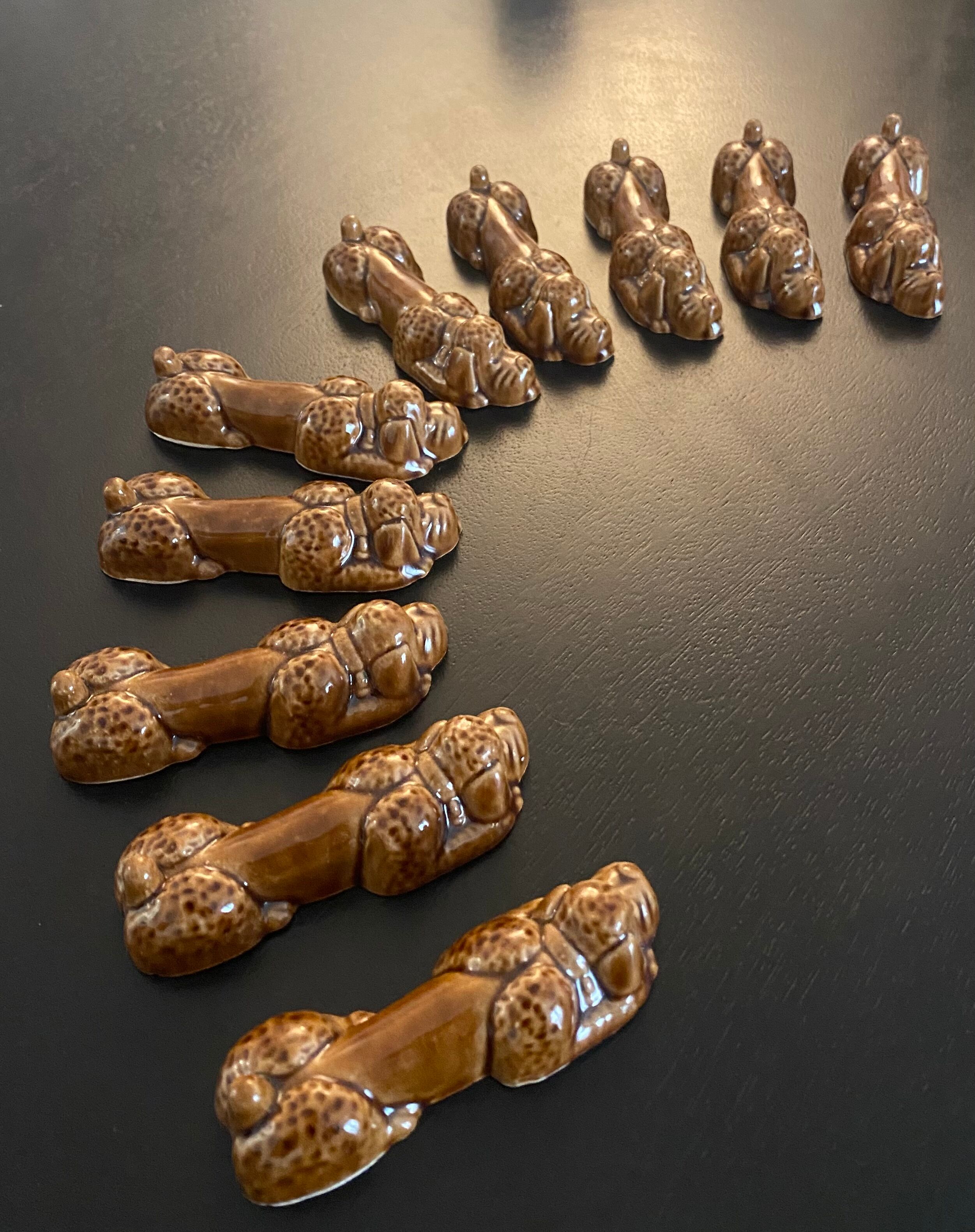 10 ceramic knife holders in the shape of a recumbent poodle