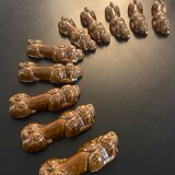 10 ceramic knife holders in the shape of a recumbent poodle
