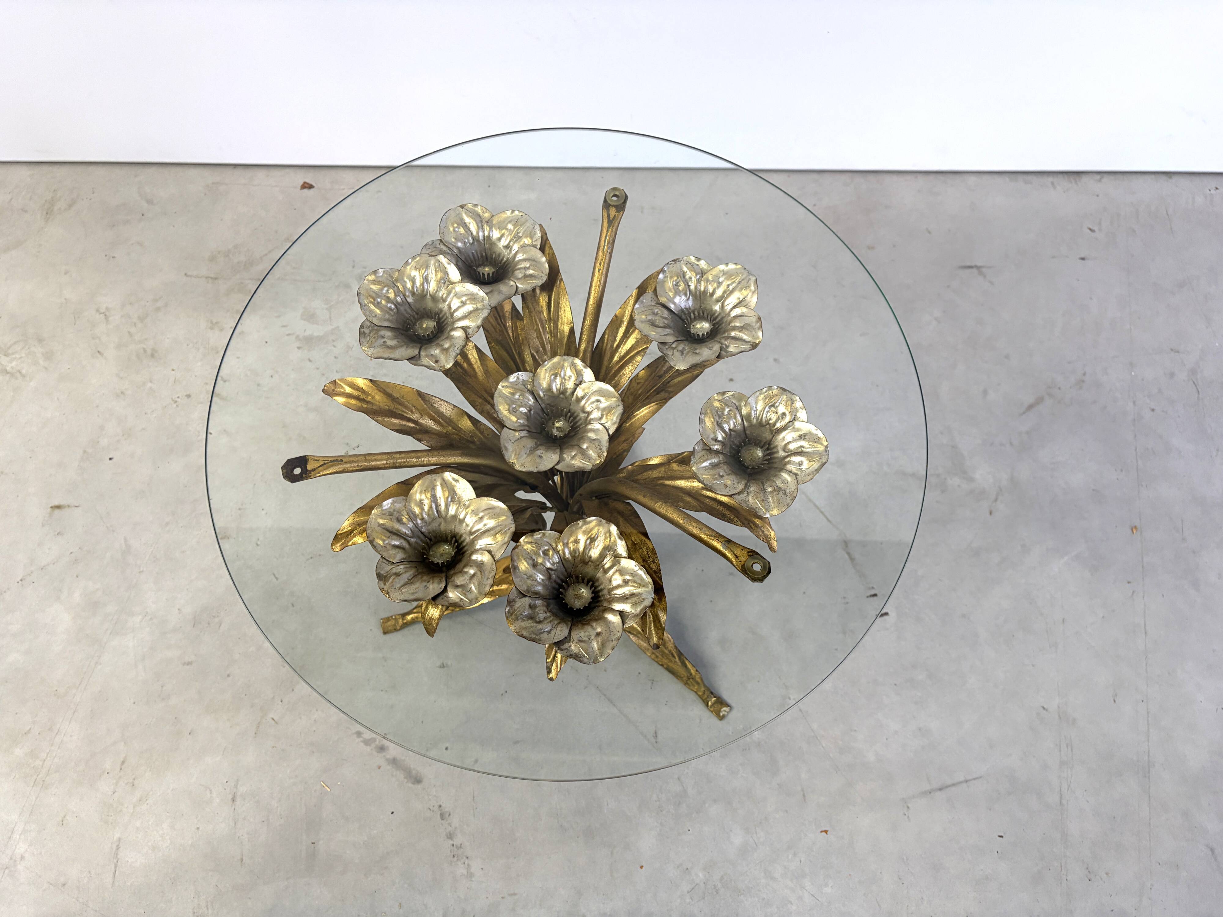 Charming metal flower coffee table or side table with a clear glass top. Made in Italy, attributed to Hans Kögl.