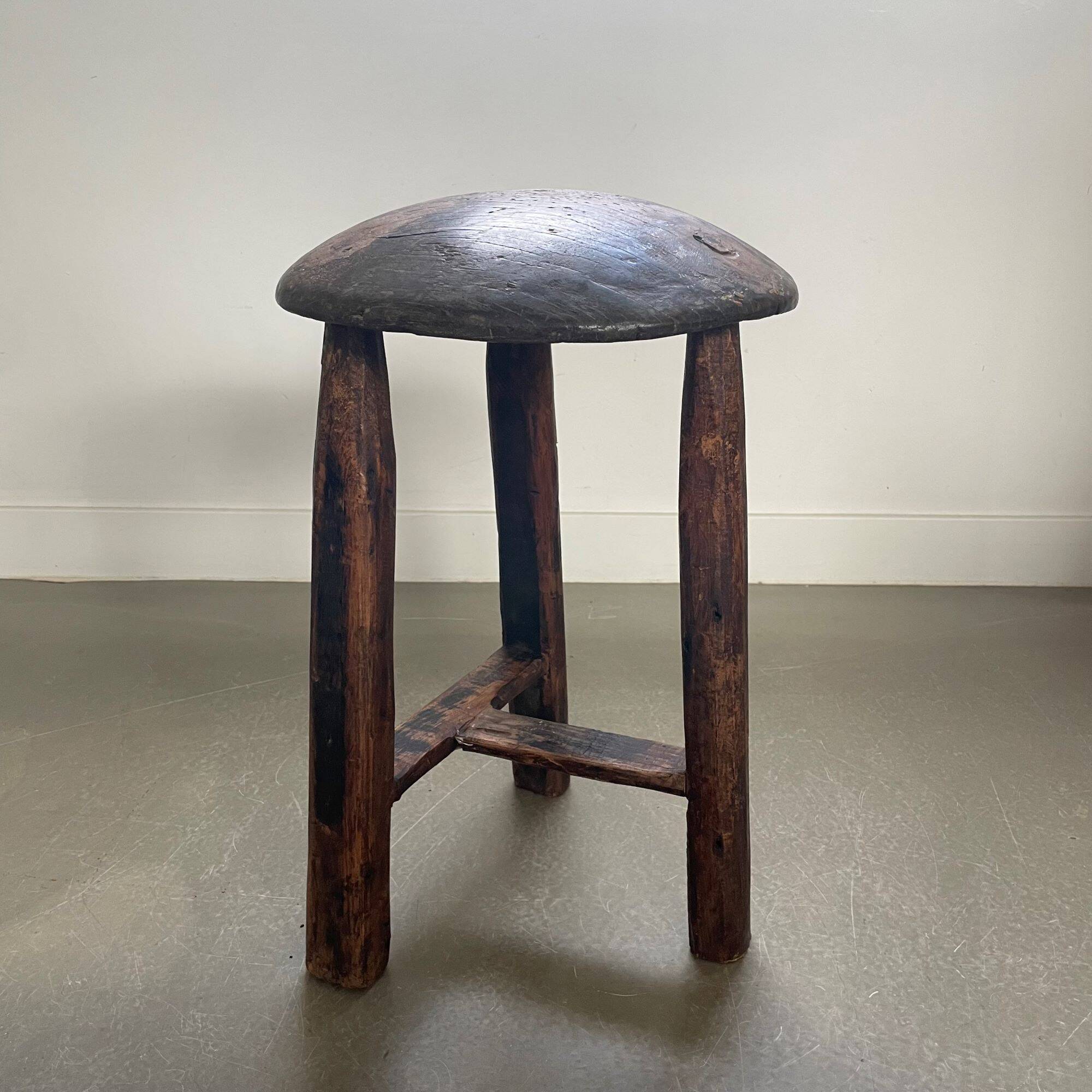 Antique tripod wooden stool, brutalist, wabi sabi style
