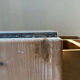 Vintage antique workshop cabinet with 12 drawers in raw wood.