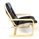 Fauteuil scandinave en cuir capitonné