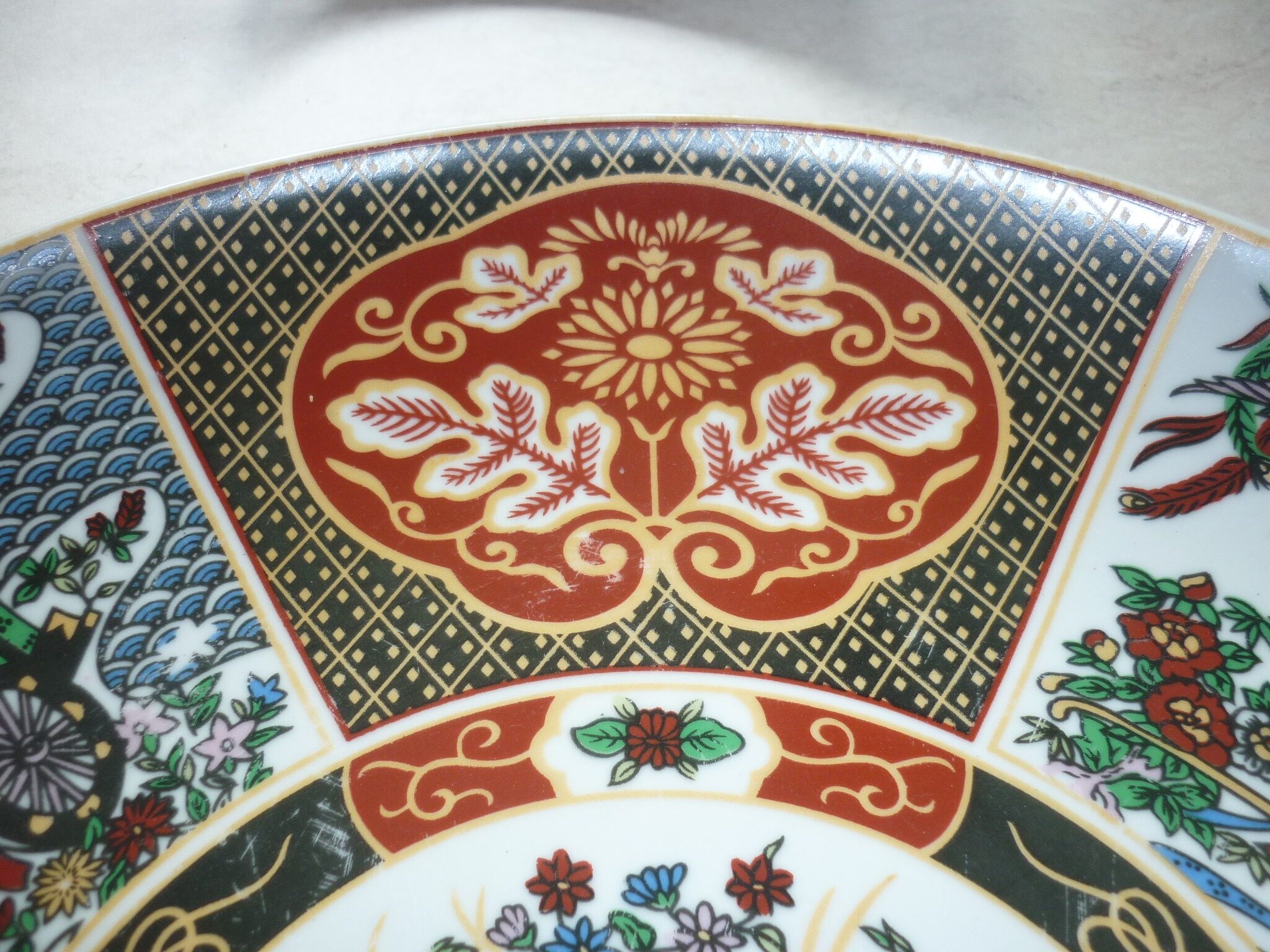 Chinese dish decorated with peacocks and plants