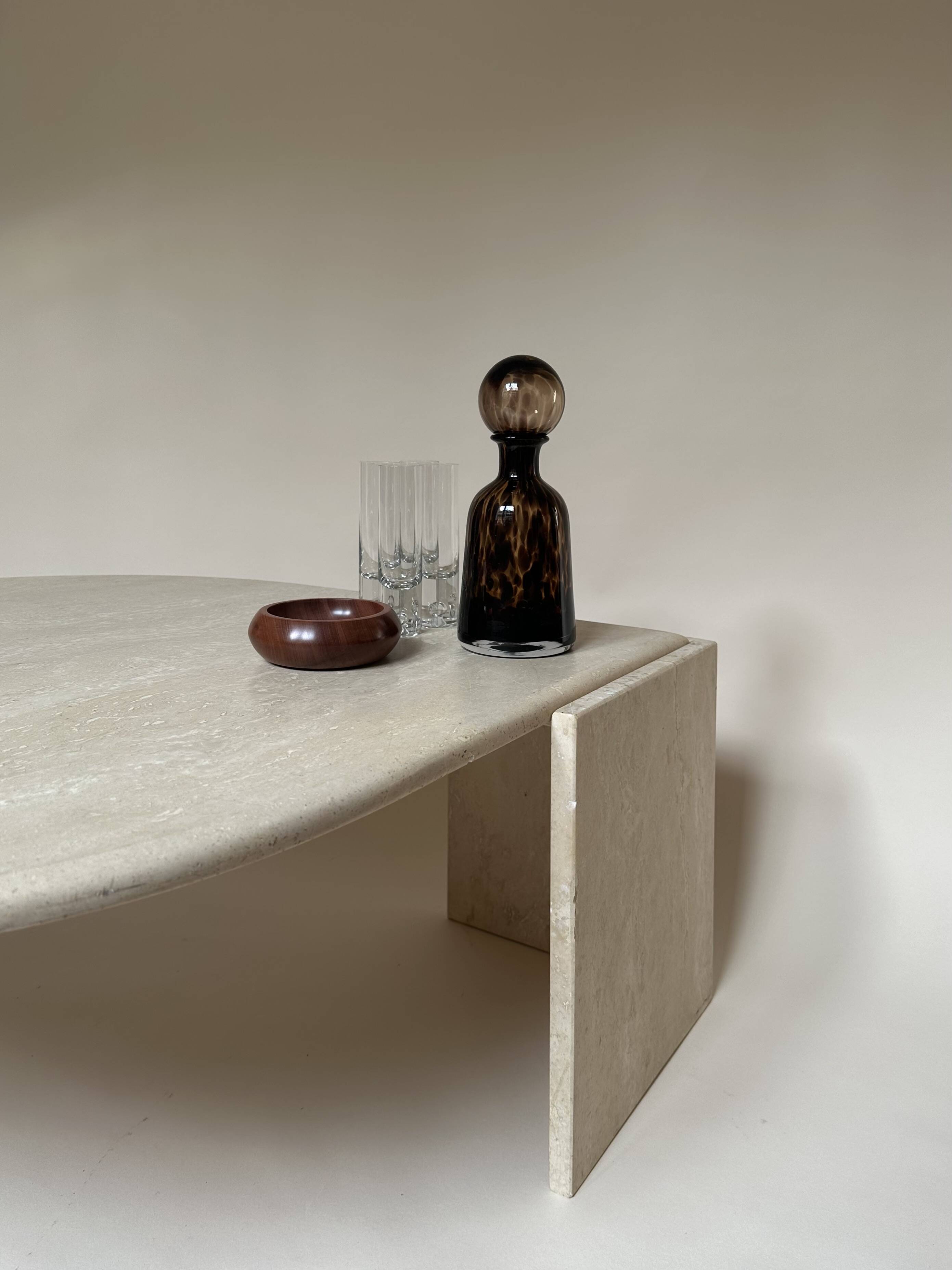 Travertine eye-shaped coffee table