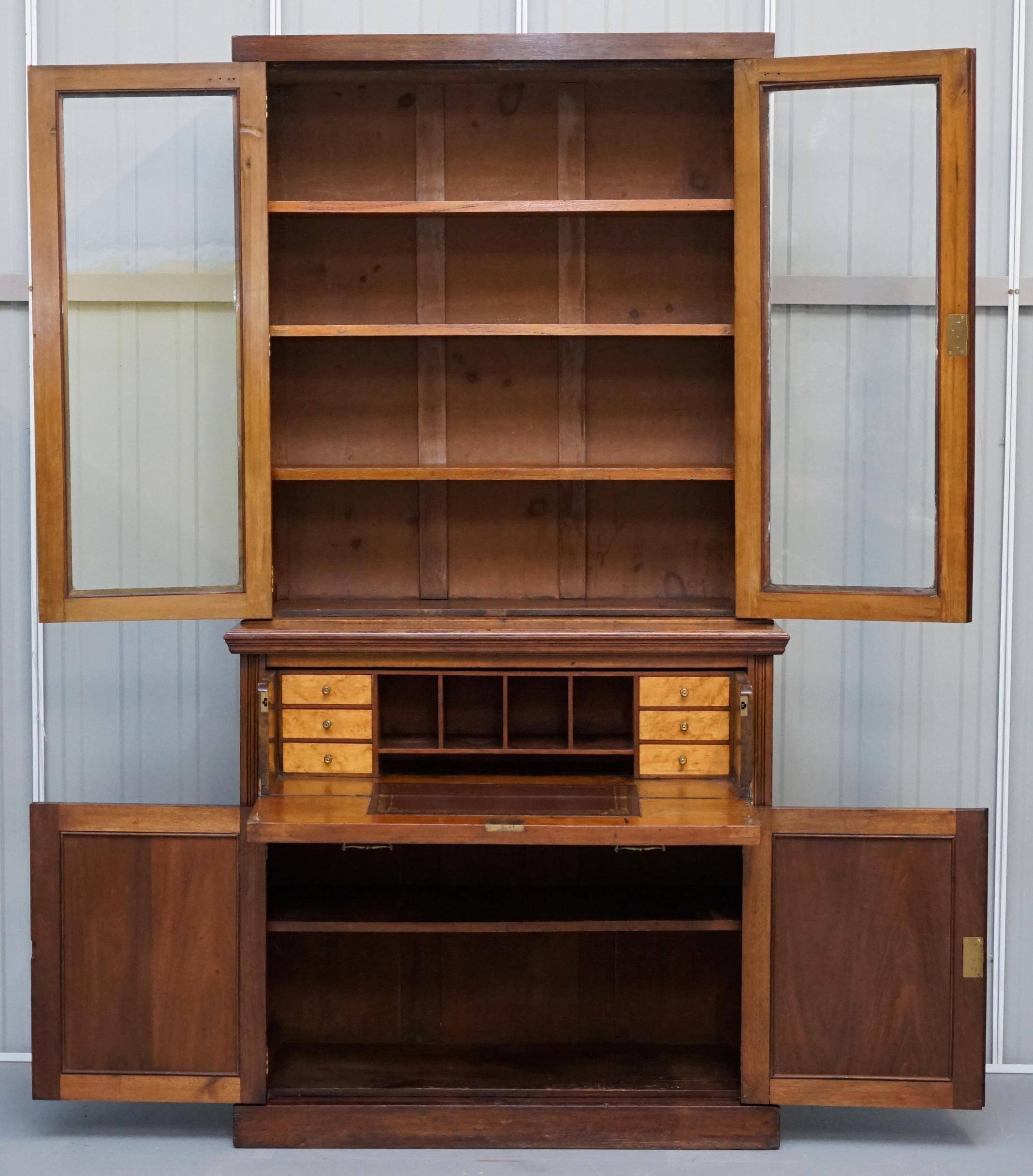 Light wood library with a secretary and leather surface.