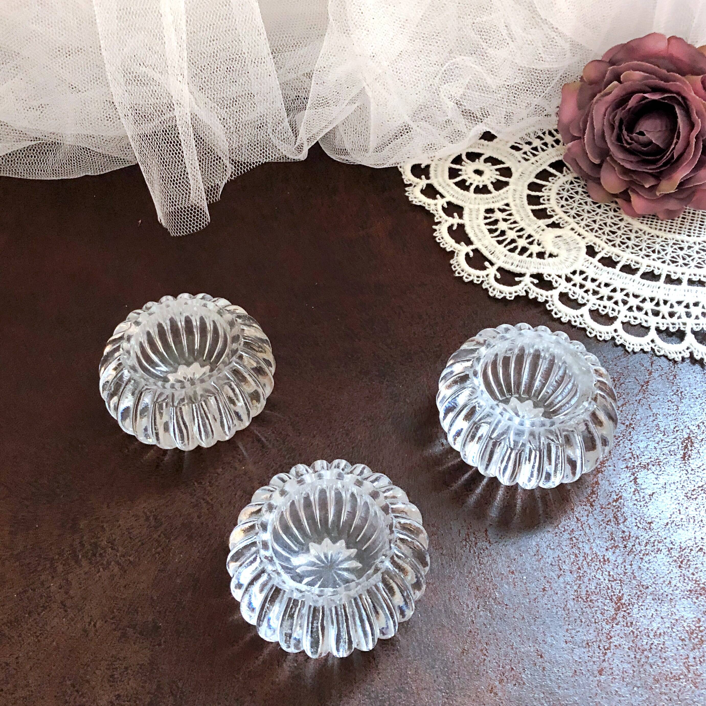 Trio of salt shakers, pepper shakers, molded glass salt shakers