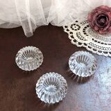 Trio of salt shakers, pepper shakers, molded glass salt shakers