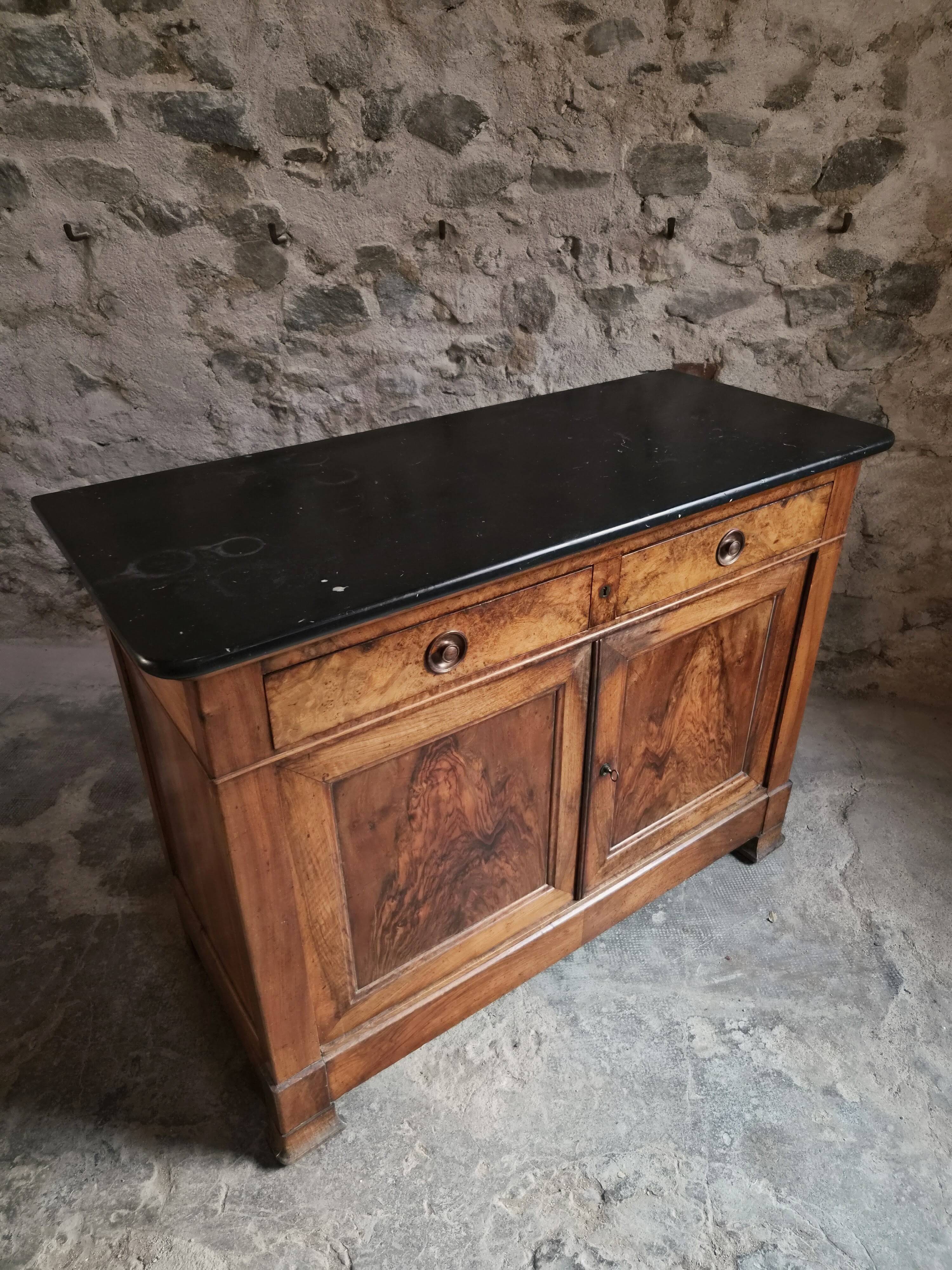 French Louis Philippe walnut buffet with black marble top, France, circa 1840–1860.