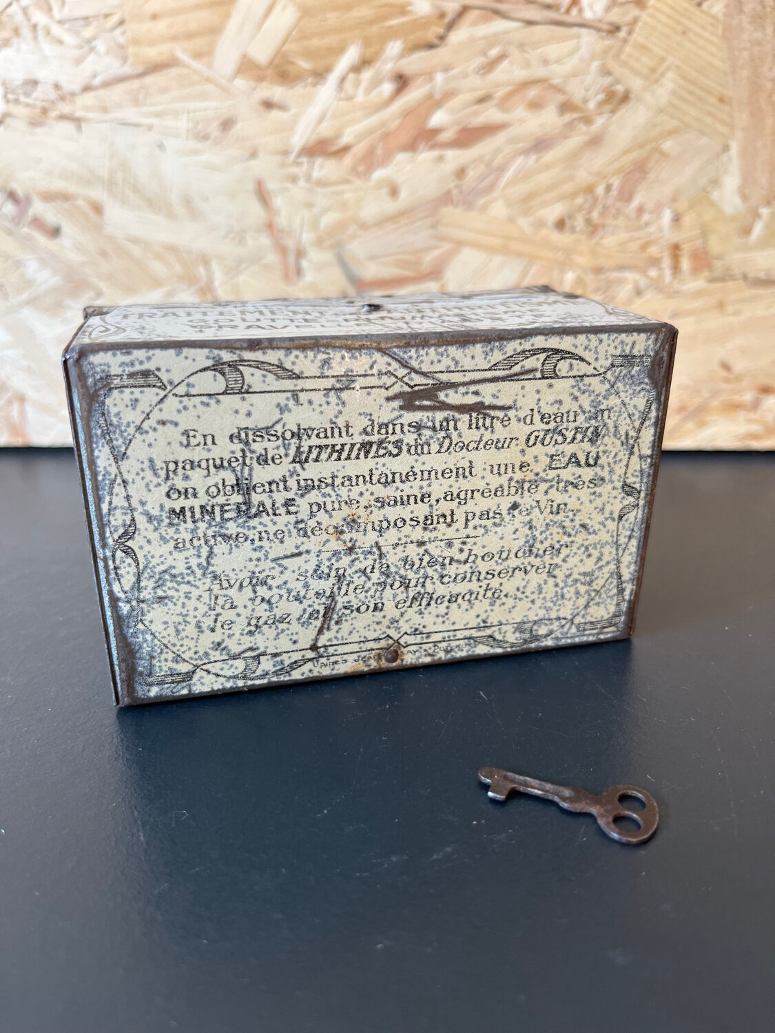 Old metal and wood medicine box with key