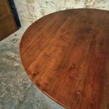 Vintage French round dining table in cherry wood, circa 1920.