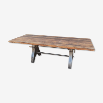 Raw wood dining table with height-adjustable foot