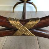 Coffee table in patinated and gilded carved wood with mirror top