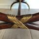 Coffee table in patinated and gilded carved wood with mirror top