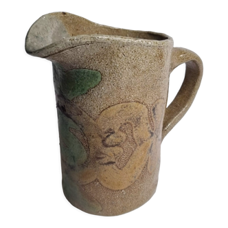 Handcrafted glazed stoneware pitcher decorated by hand