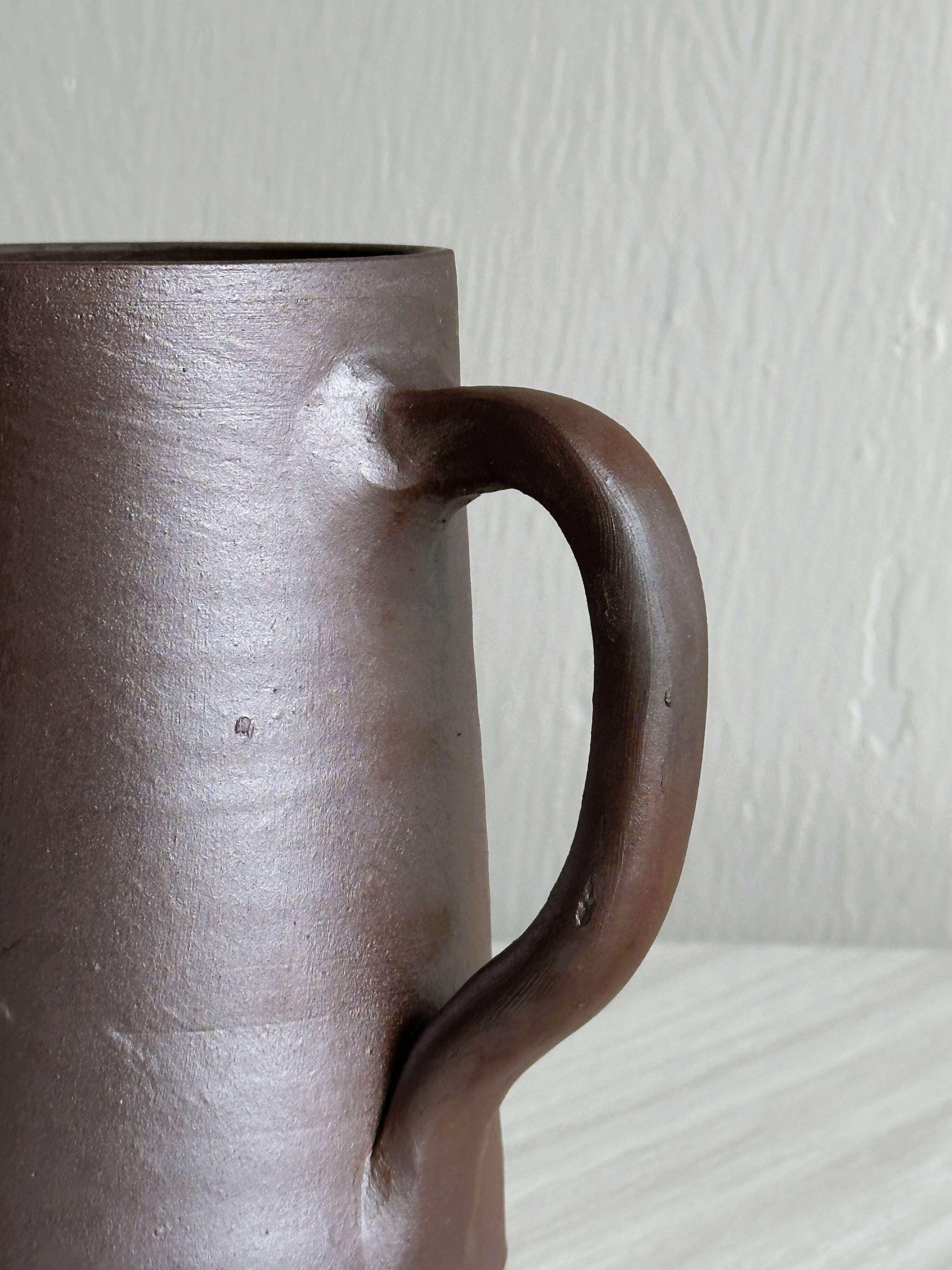 Small pitcher in brown glazed stoneware