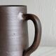 Small pitcher in brown glazed stoneware