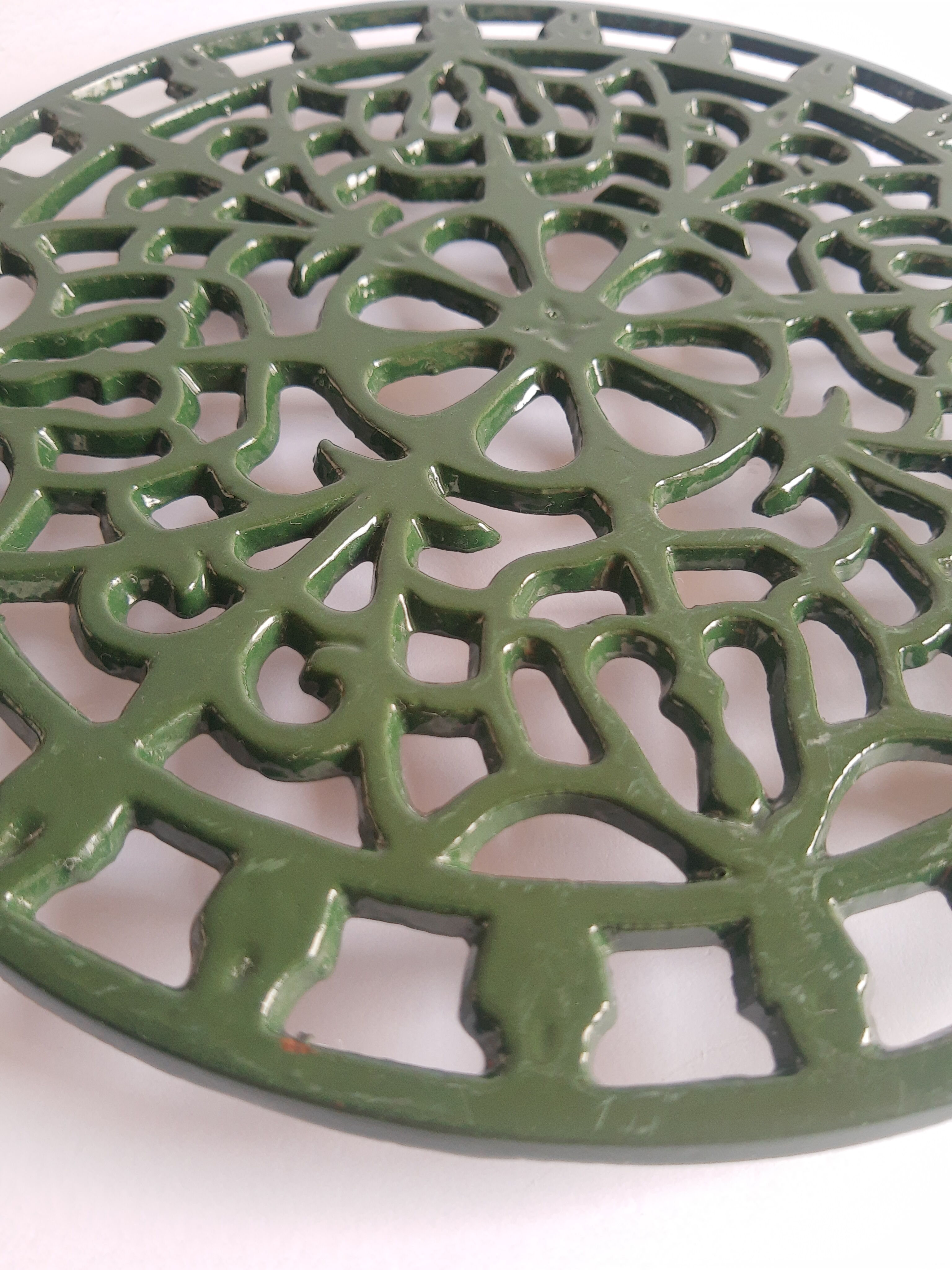 Vintage green cast iron trivet