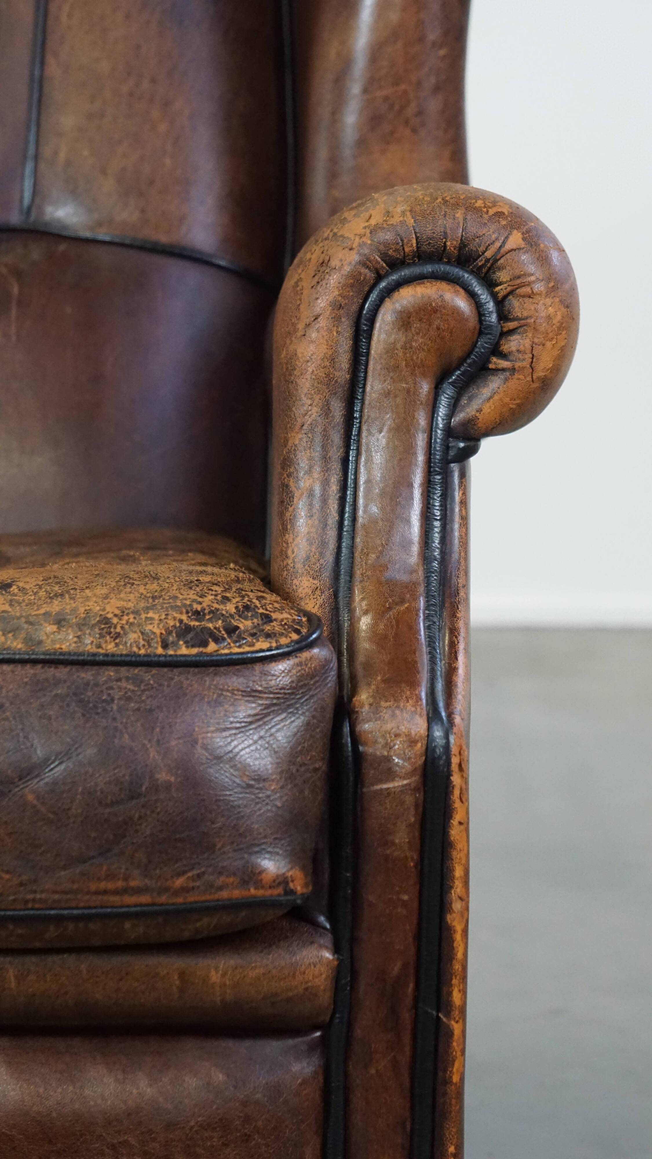 Sheep leather wing chair with patina