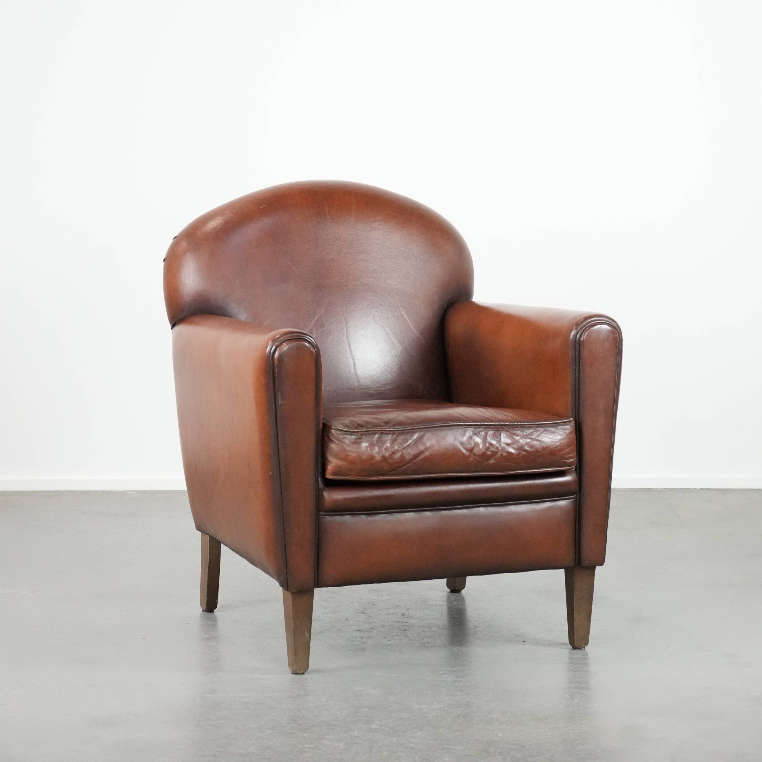 Sheepskin art deco design armchair with timeless and warm colours