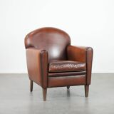 Sheepskin art deco design armchair with timeless and warm colours