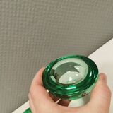 A set of iitalla candle holders in green transparent glass.