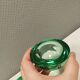 Un ensemble de porte-bougies iittala en verre transparent vert.