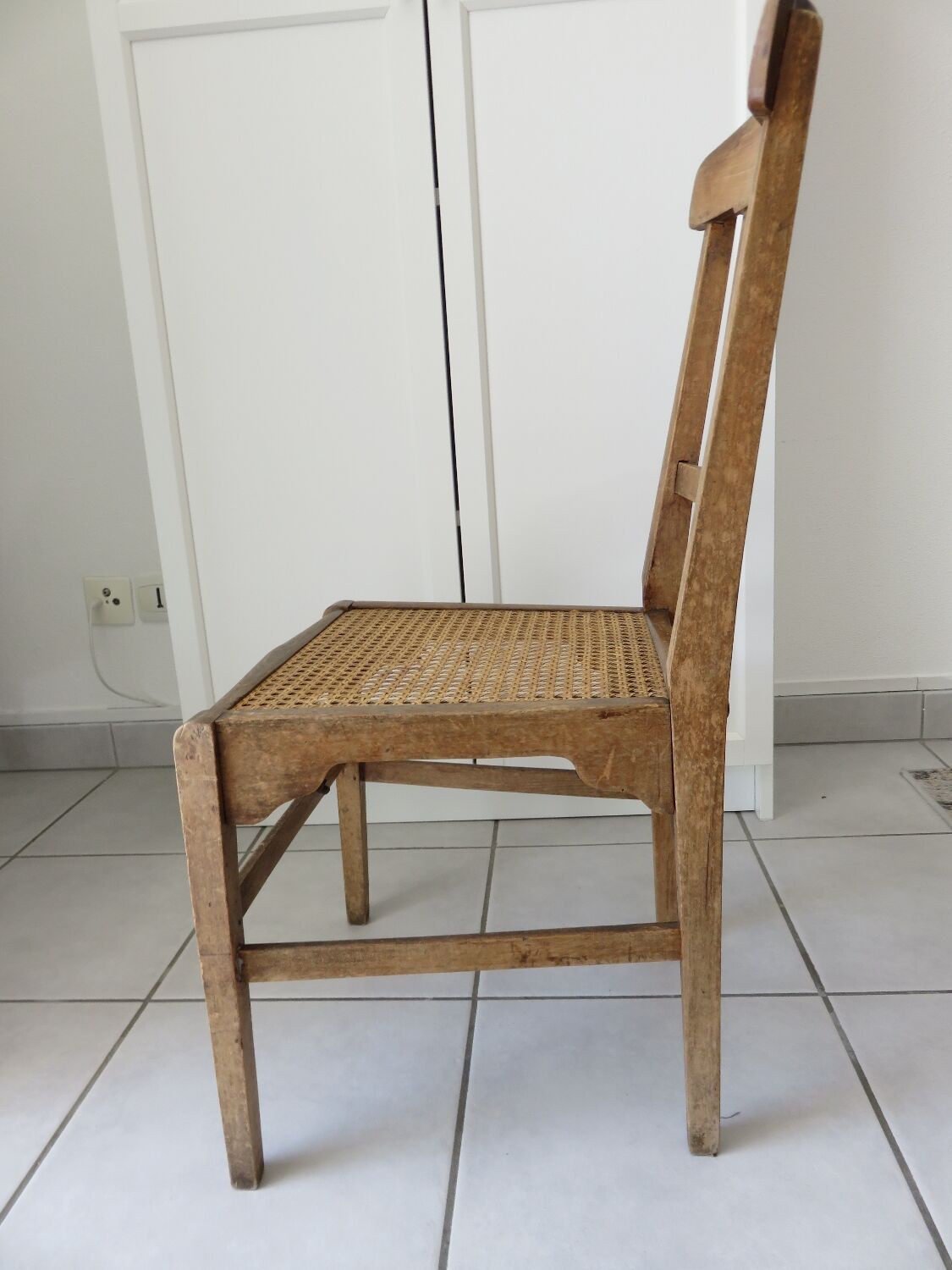 Antique solid wood chair with caning, country house style.