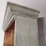 Craft cabinet with drawers with a very old tobacco advertisement in the background