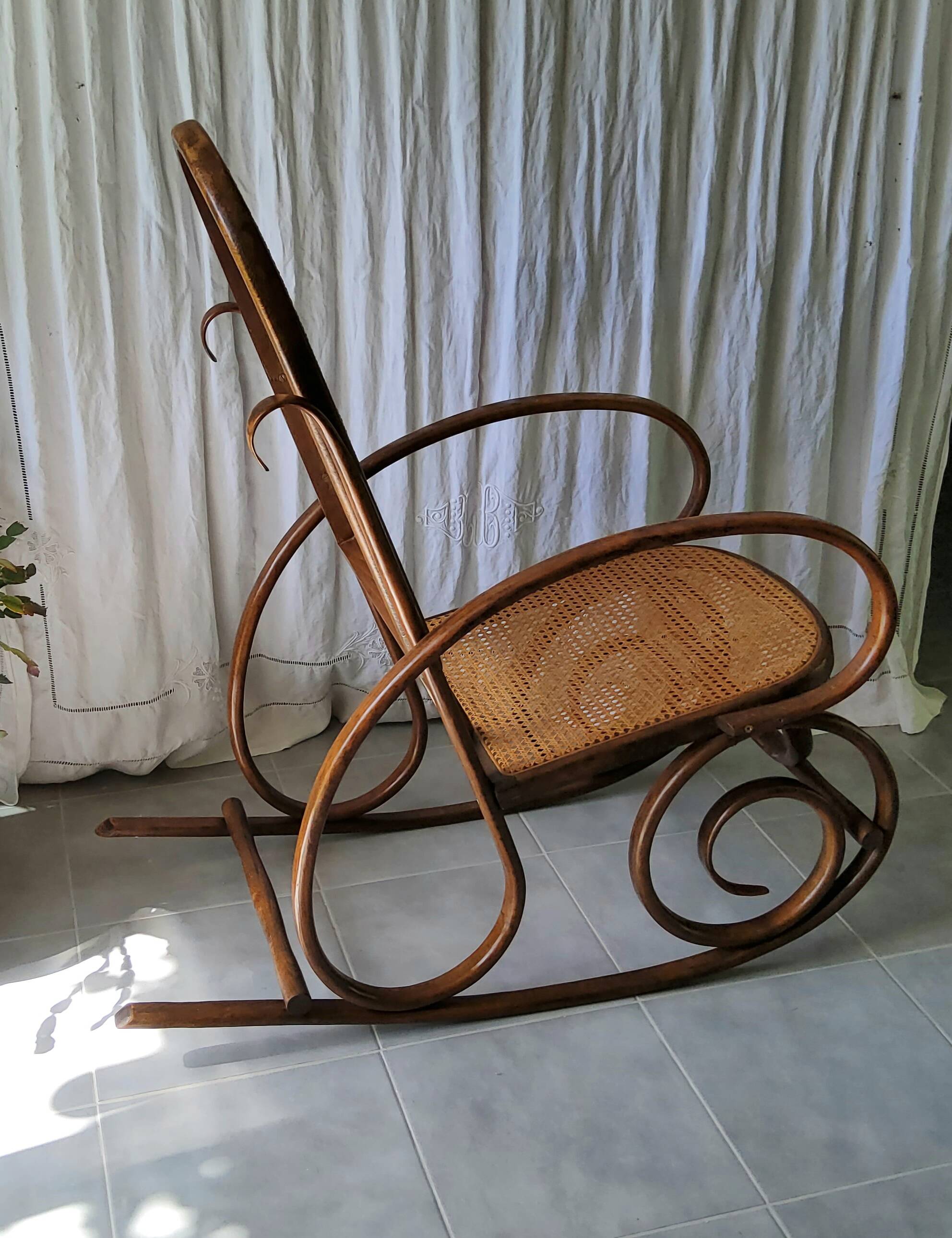 Antique caned rocking chair