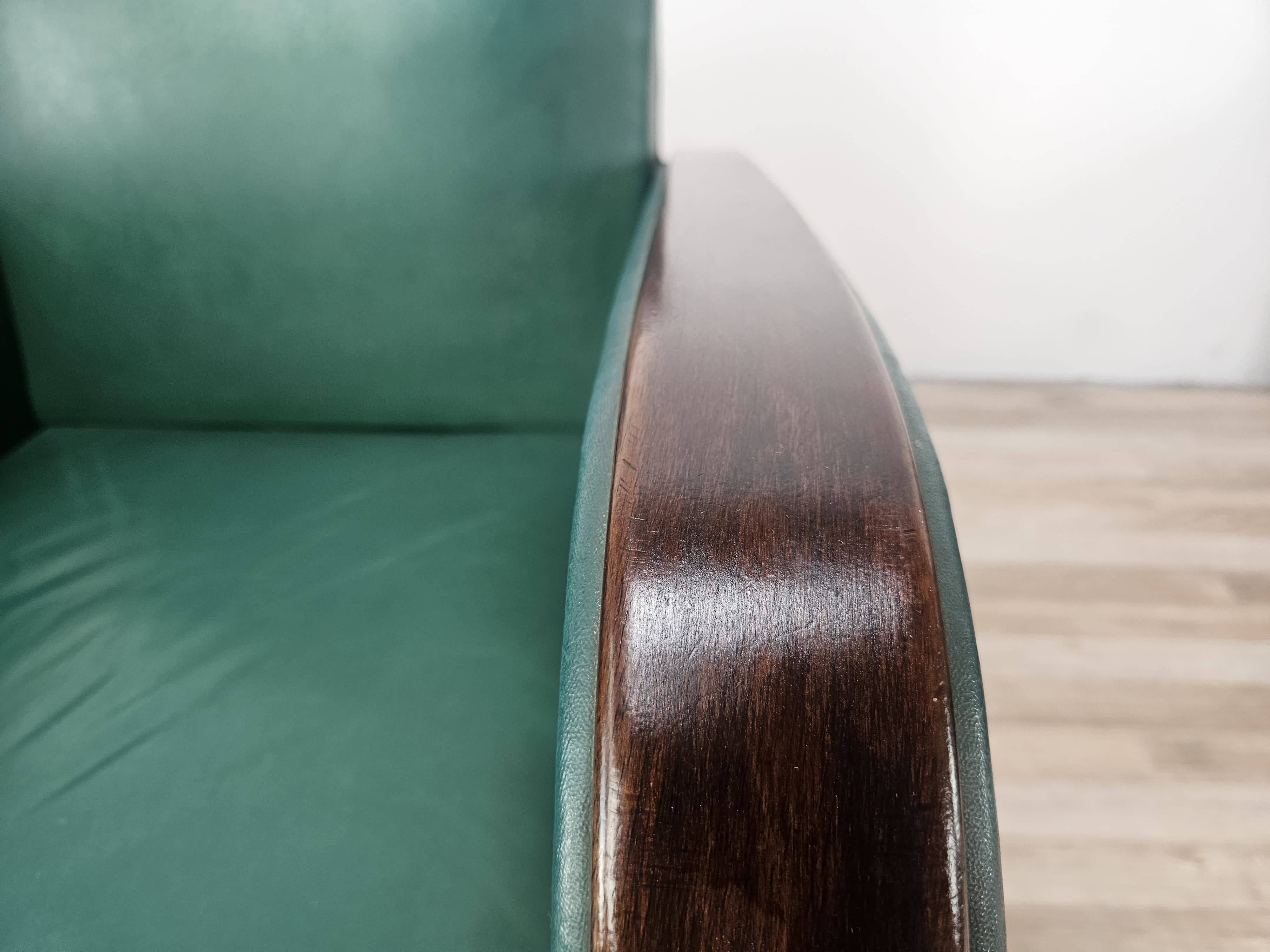 Pair of Art Decò armchairs in walnut and green leather, 1940