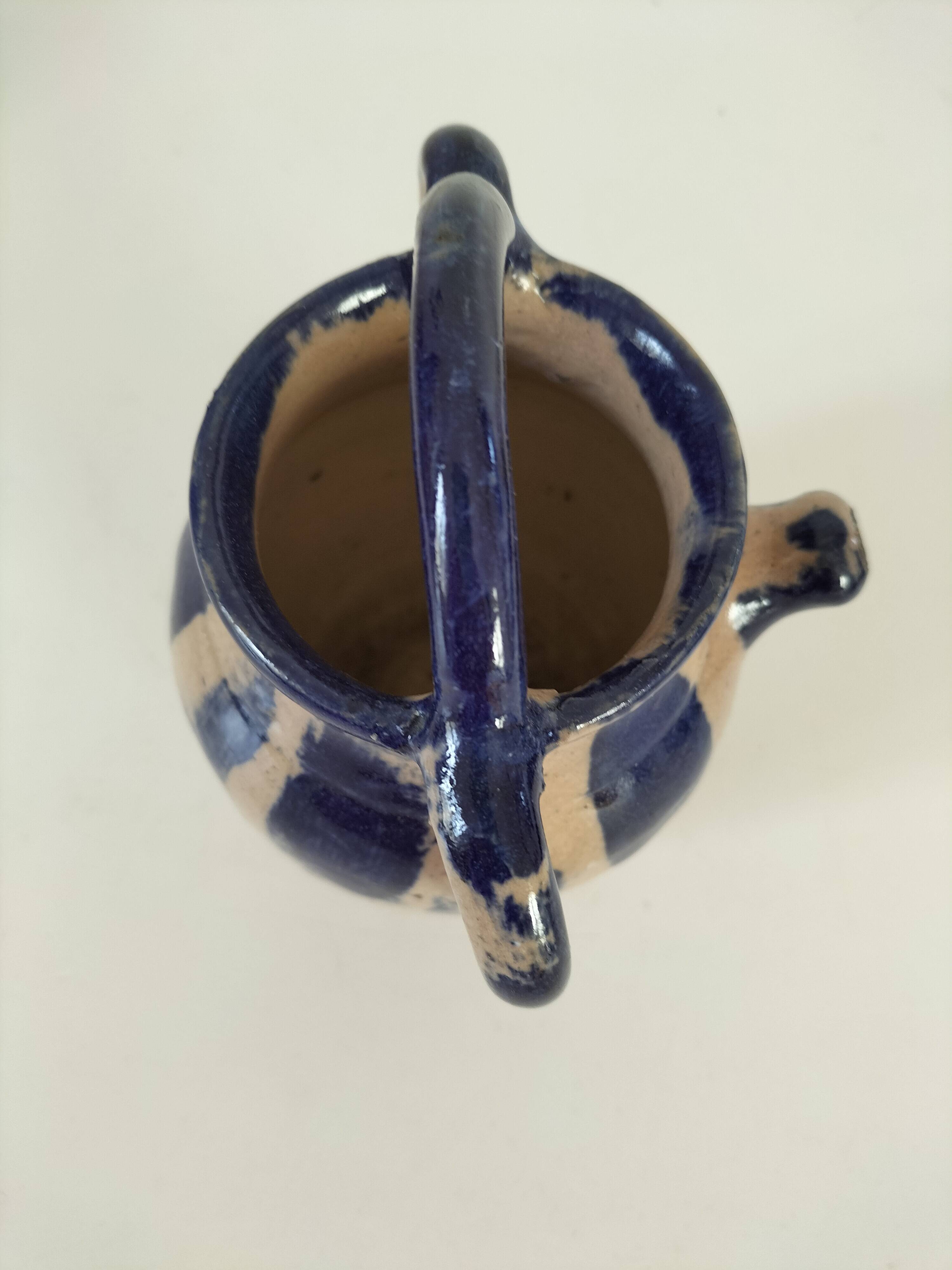 Old pitcher (goat) in cobalt glazed earthenware