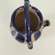 Old pitcher (goat) in cobalt glazed earthenware