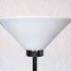 Vintage floor lamp in milky glass and chrome, minimalist uplight lighting.
