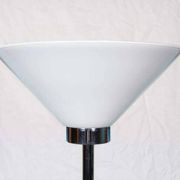 Vintage floor lamp in milky glass and chrome, minimalist uplight lighting.