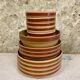 Lot of vintage Gien stoneware from France, 14 pieces including bowls and salad plates.