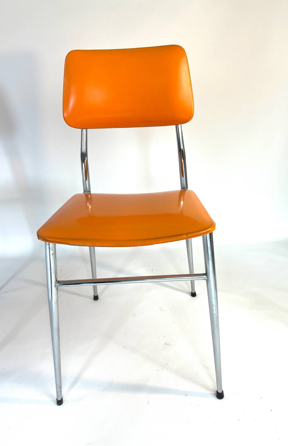Pair of vintage orange leatherette chairs