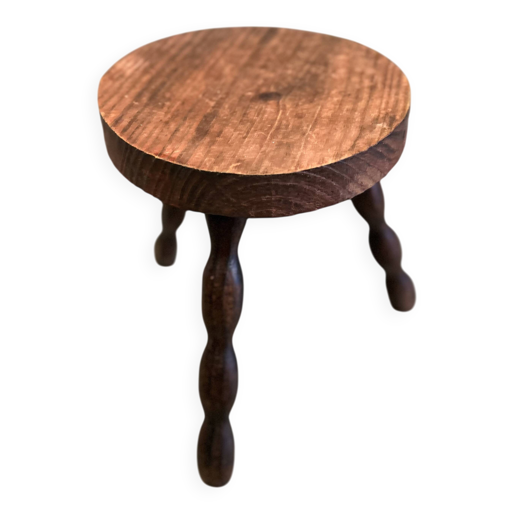 Three-legged stool with beaded wooden legs