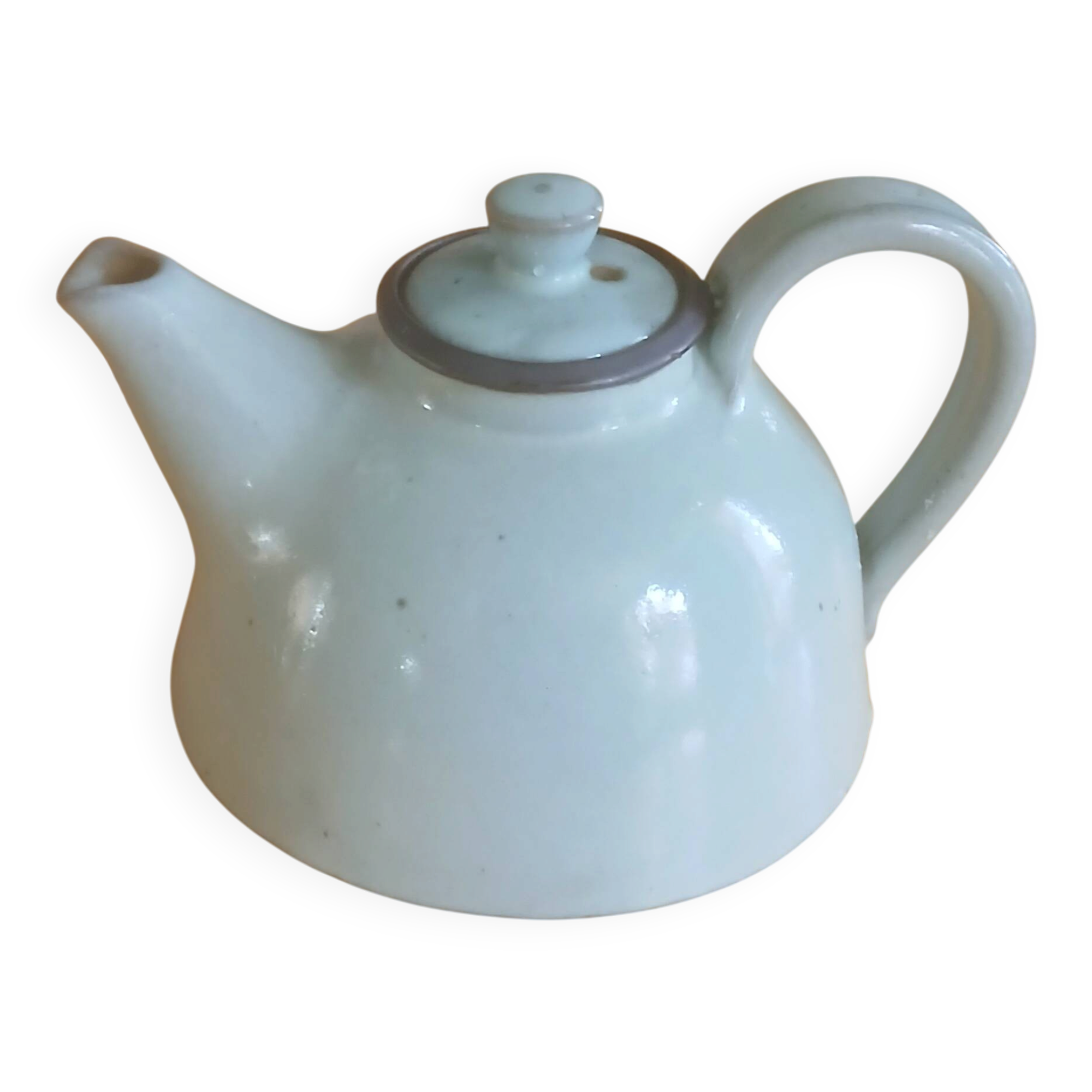 Vintage artisanal style glazed pottery teapot