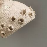 Ceramic hanging lamp in creamy white color that almost looks like a corral