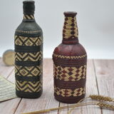 Set of 2 decorative vintage bottles covered with leather & wicker