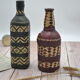 Set of 2 decorative vintage bottles covered with leather & wicker