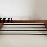 Vintage Scandinavian wall coat rack in wood and metal.