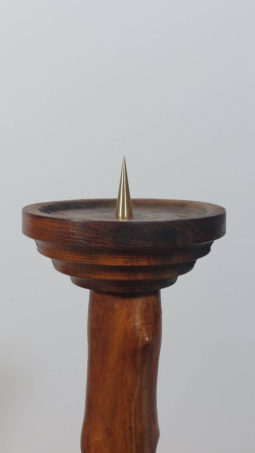 Vintage candle holder in an organic shape with a brass spike and tiered top.