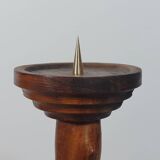 Vintage candle holder in an organic shape with a brass spike and tiered top.