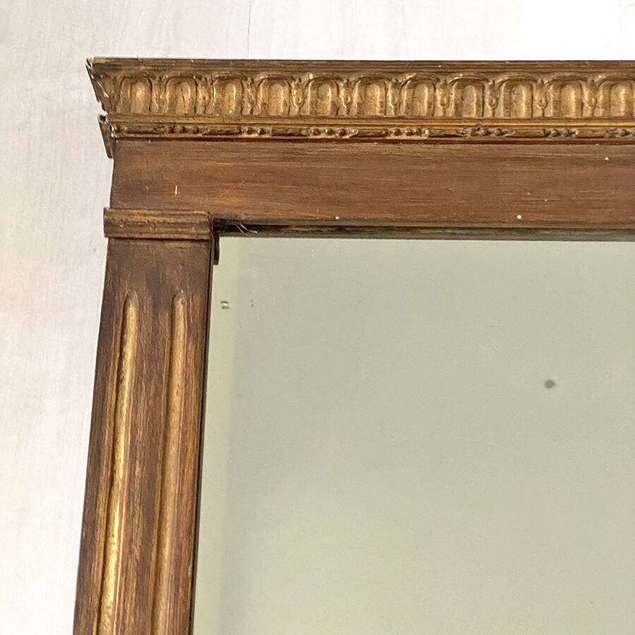 Small golden mirror in Louis XVI style.